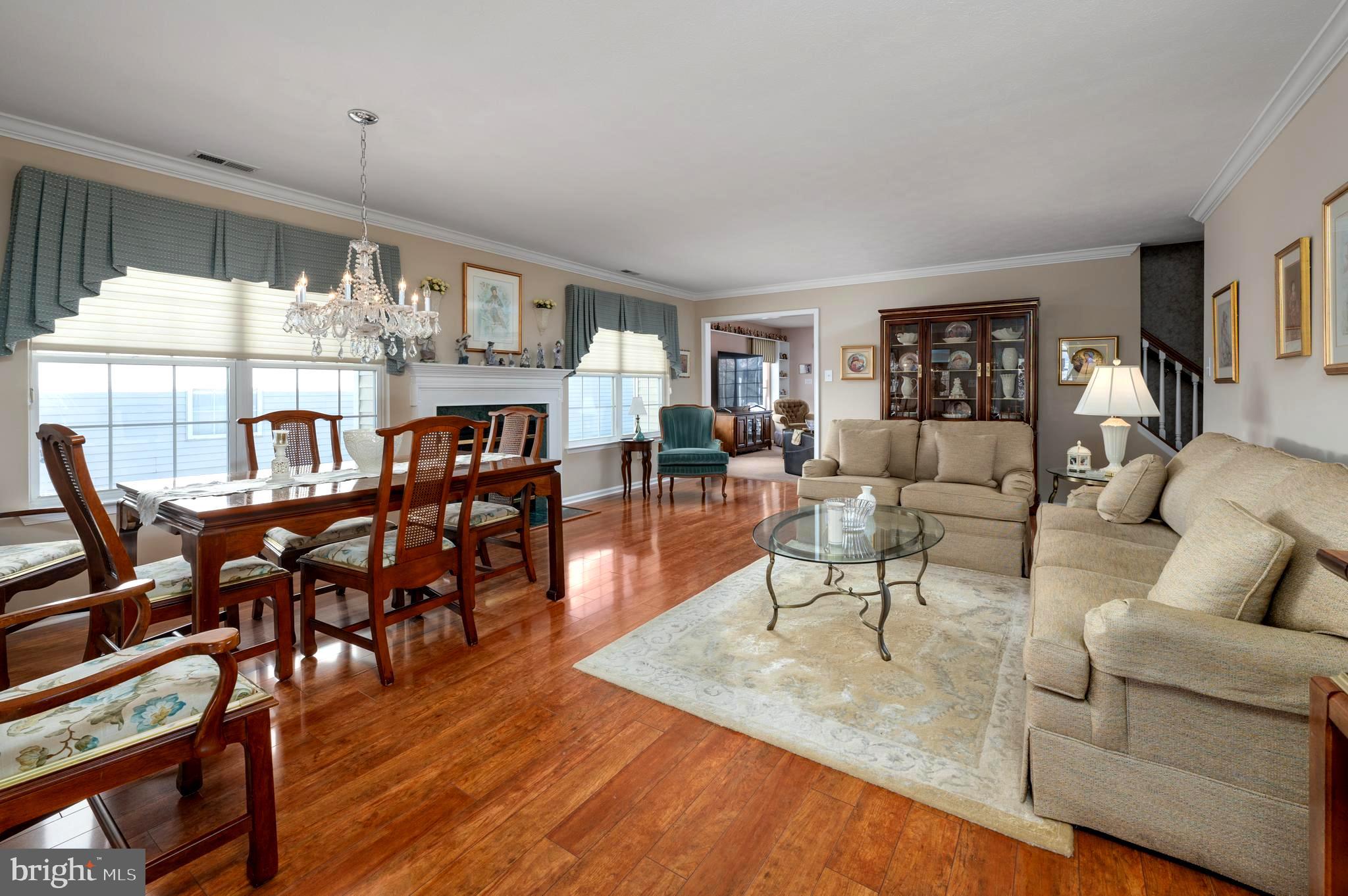 515 Hydrangea Drive Mount Laurel, NJ 08054 - Photo 7 of 36 a living room with furniture dining table and wooden floor