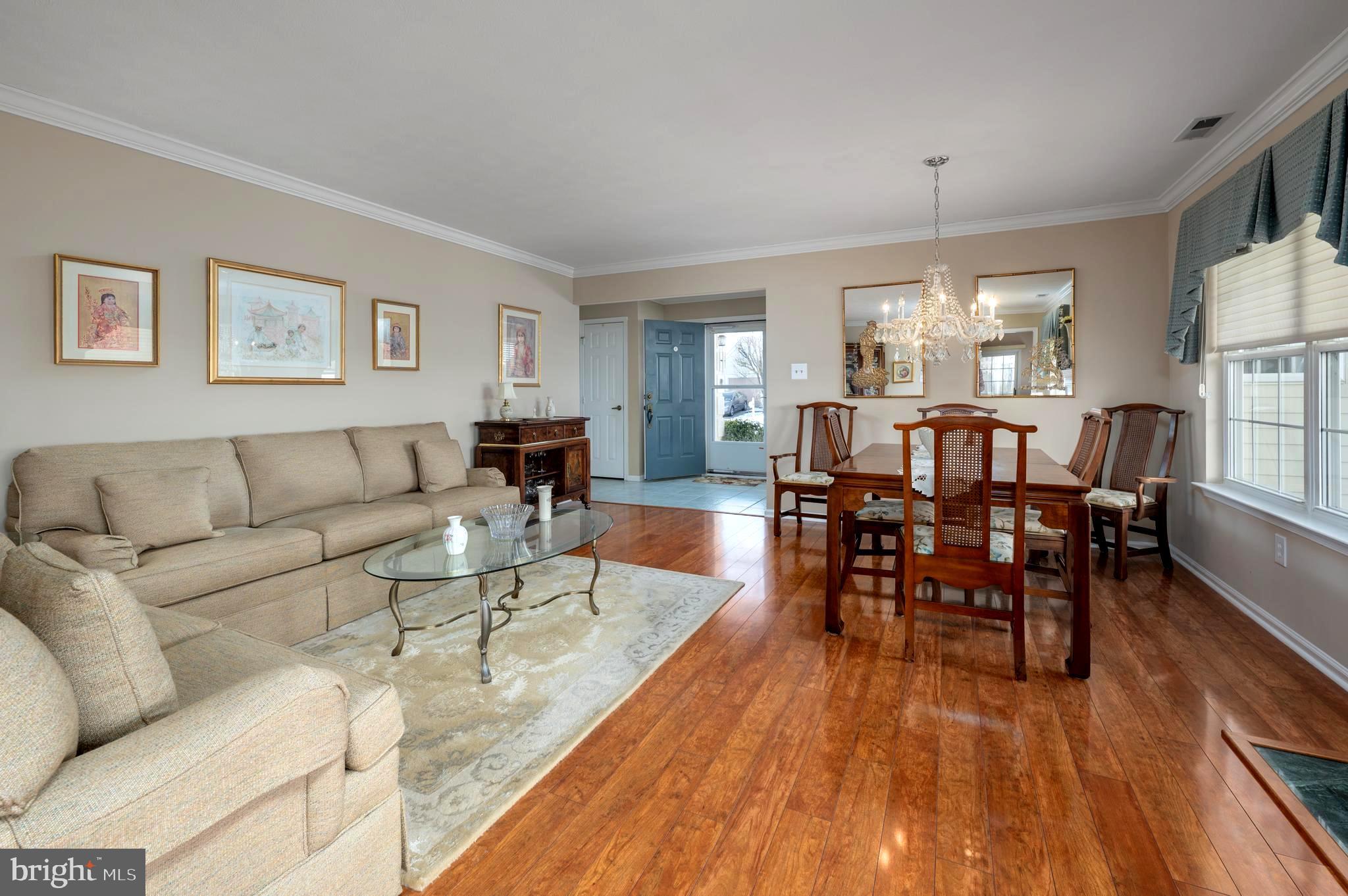 515 Hydrangea Drive Mount Laurel, NJ 08054 - Photo 8 of 36 a living room with furniture dining table and a large window