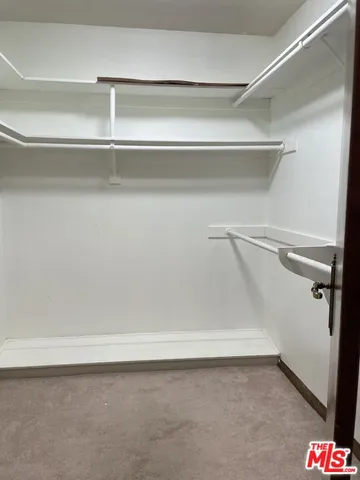 a bathroom with a double vanity sink a mirror and a bathtub