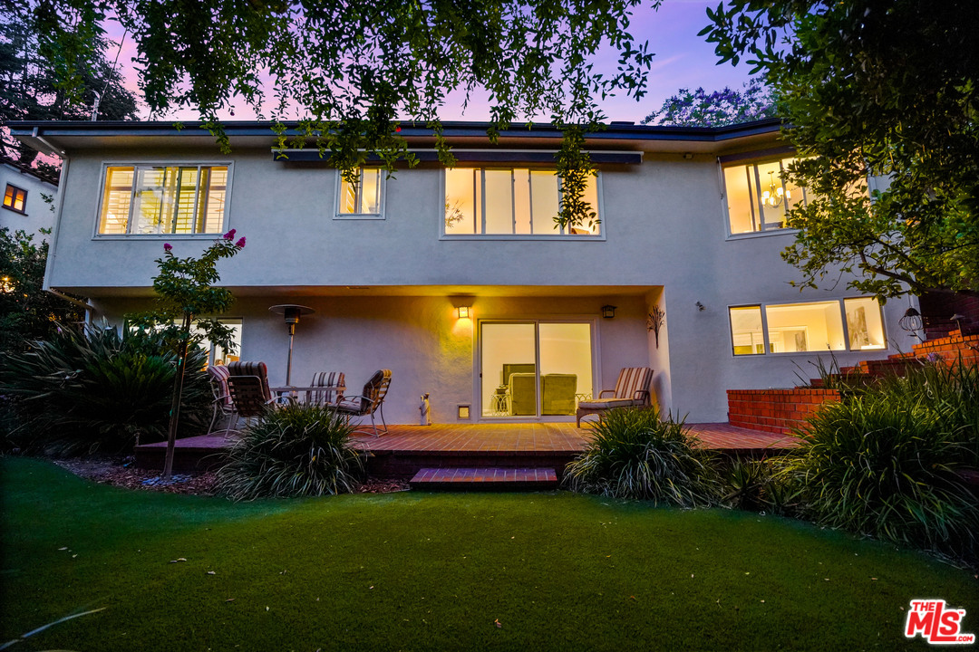 910 Hillcroft Road Glendale, CA 91207 - Photo 2 of 37 a front view of a house with a yard table and chairs