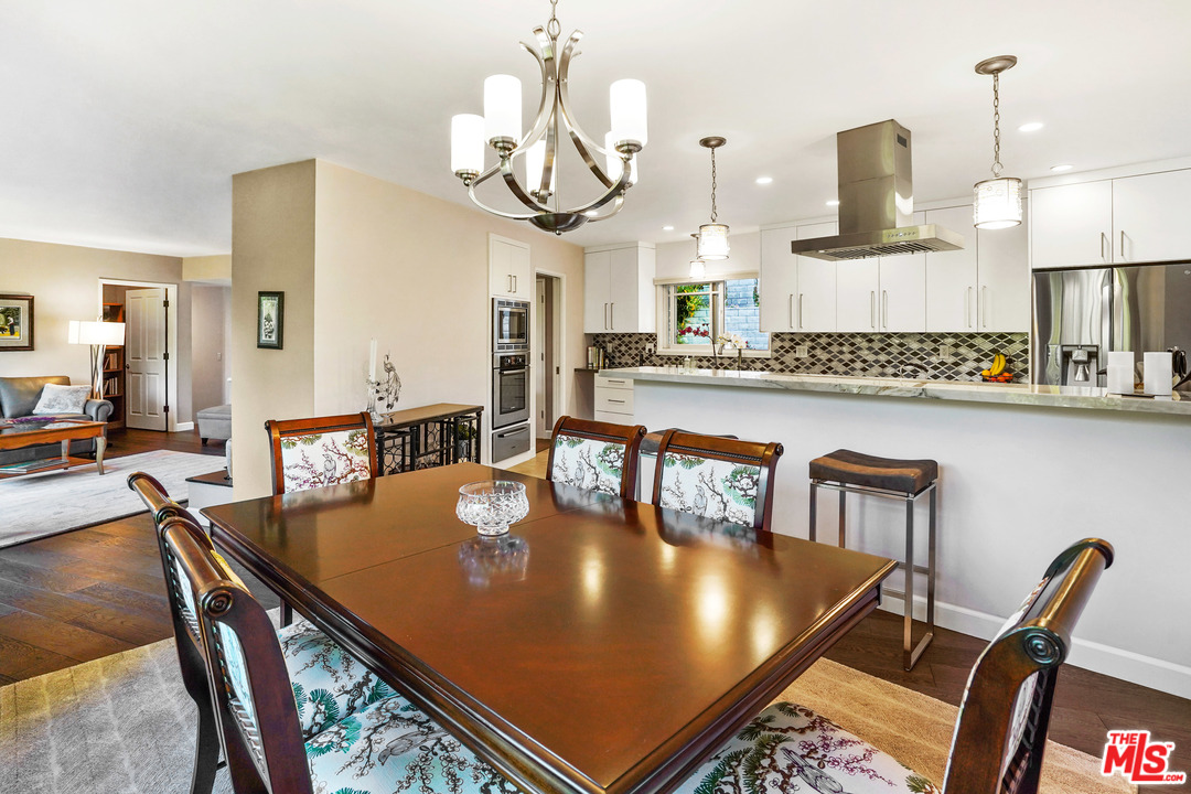 910 Hillcroft Road Glendale, CA 91207 - Photo 11 of 37 a kitchen with stainless steel appliances granite countertop a sink a stove and chairs