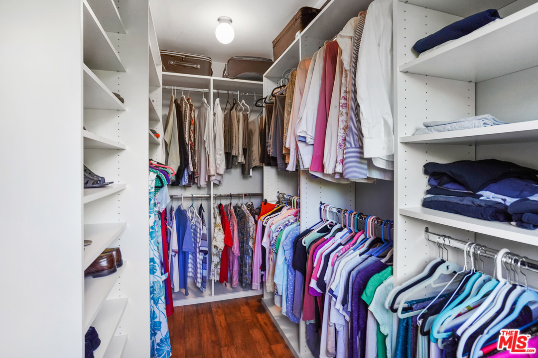 910 Hillcroft Road Glendale, CA 91207 - Photo 17 of 37 a view of walk in closet with clothes and shoes