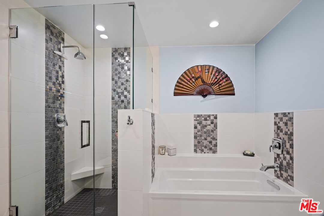 910 Hillcroft Road Glendale, CA 91207 - Photo 20 of 37 a bathroom with a bathtub and a shower
