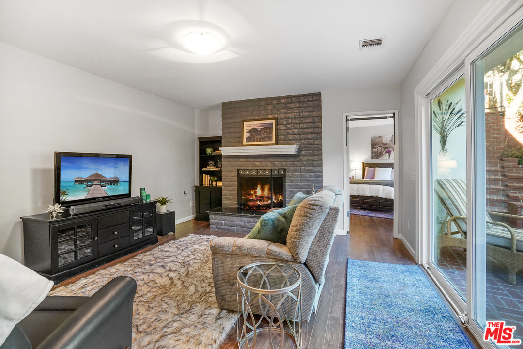 910 Hillcroft Road Glendale, CA 91207 - Photo 23 of 37 a living room with furniture a flat screen tv and a fireplace