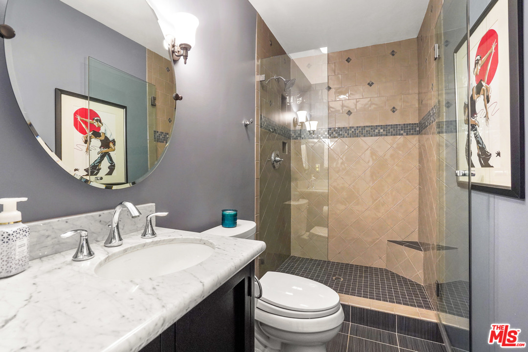 910 Hillcroft Road Glendale, CA 91207 - Photo 25 of 37 a bathroom with a granite countertop sink toilet and shower