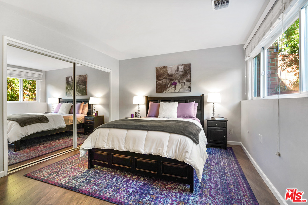 910 Hillcroft Road Glendale, CA 91207 - Photo 28 of 37 a bedroom with a bed a couch and large window