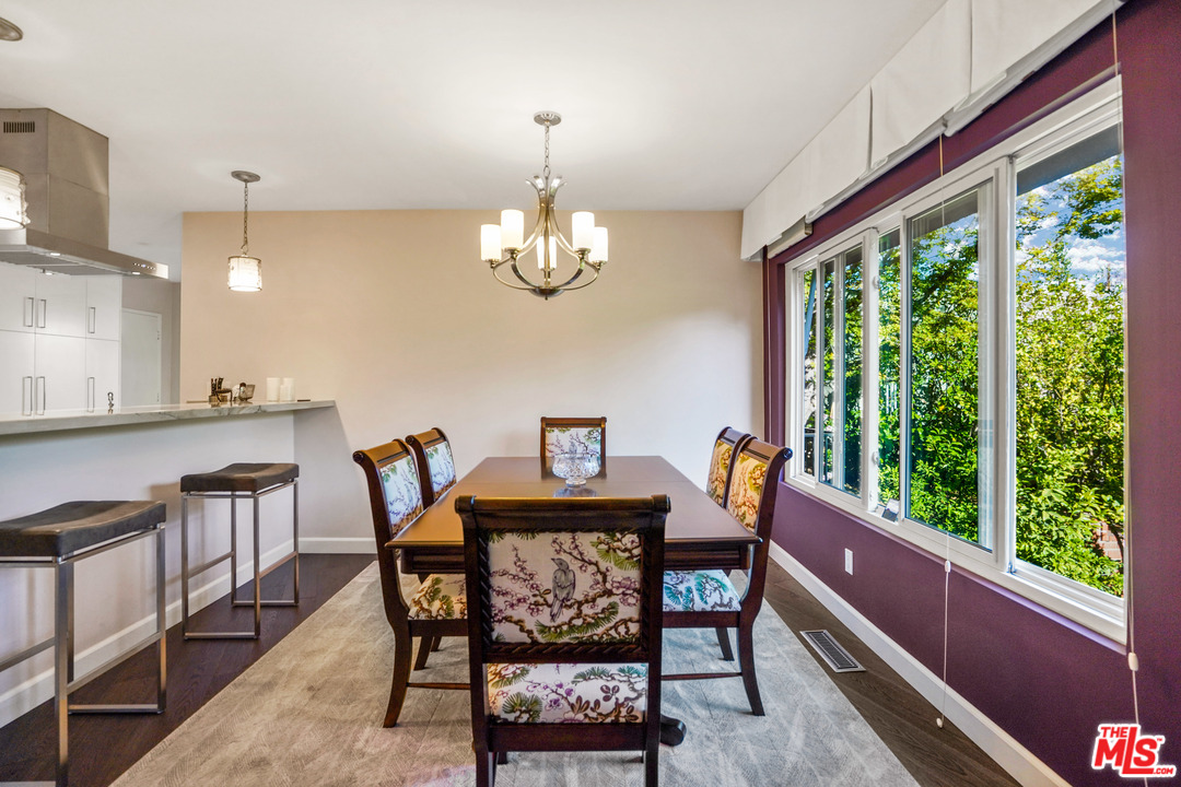910 Hillcroft Road Glendale, CA 91207 - Photo 10 of 37 a view of a dining room with furniture a chandelier and wooden floor