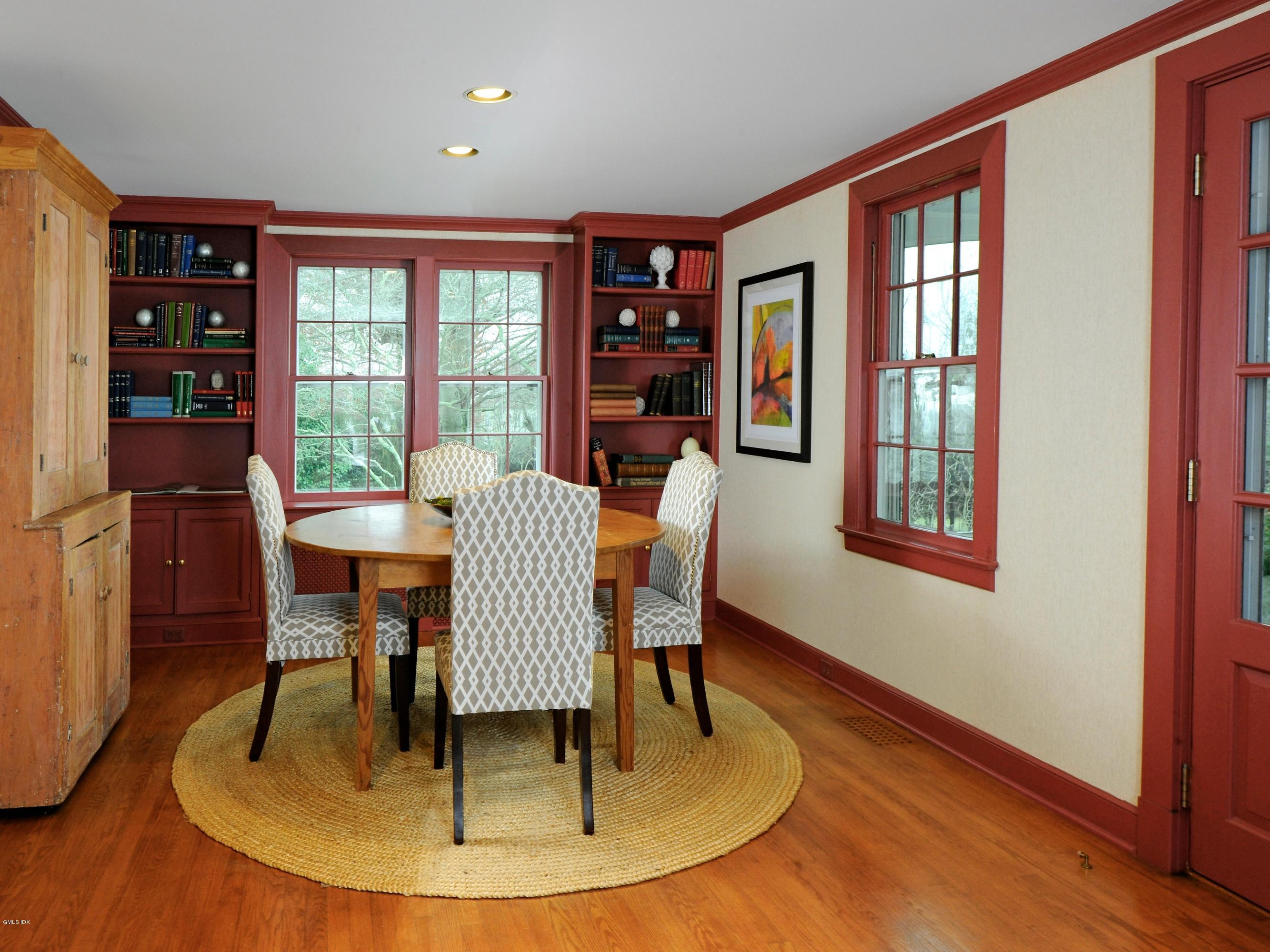 141 Taconic Road Greenwich, CT 06831 - Photo 11 of 30 a dining room with furniture window and wooden floor