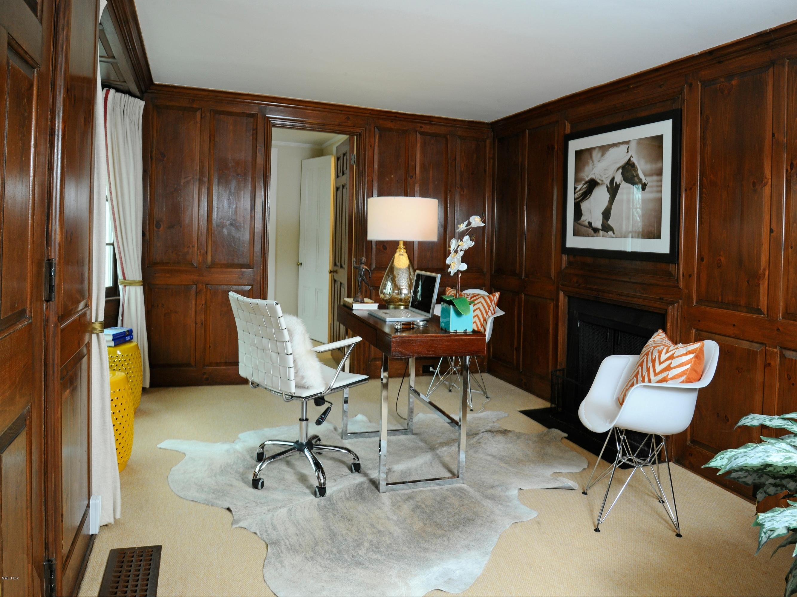 141 Taconic Road Greenwich, CT 06831 - Photo 12 of 30 a living room with furniture and a potted plant