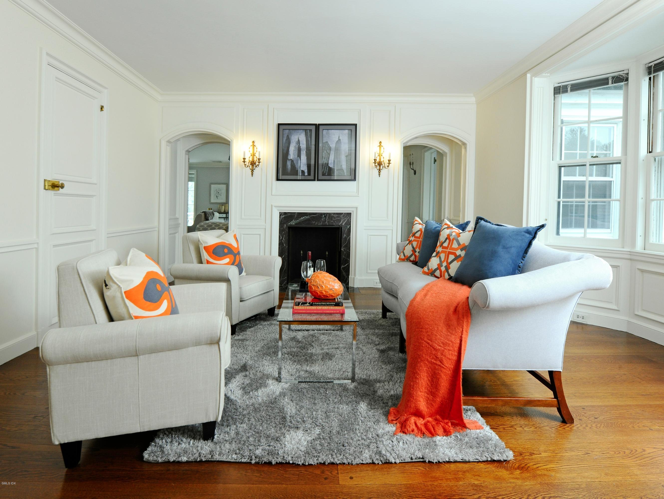 141 Taconic Road Greenwich, CT 06831 - Photo 16 of 30 a living room with furniture and a fireplace