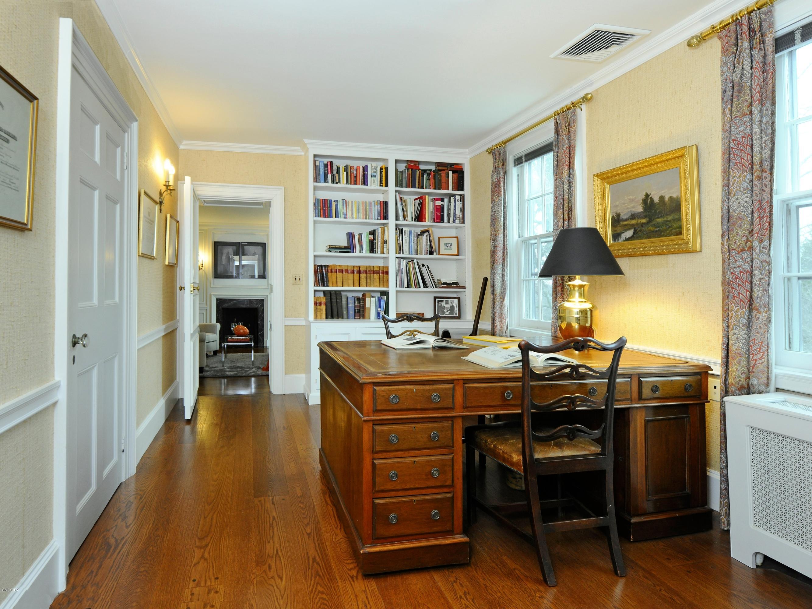 141 Taconic Road Greenwich, CT 06831 - Photo 17 of 30 a view of a workspace with furniture and a window