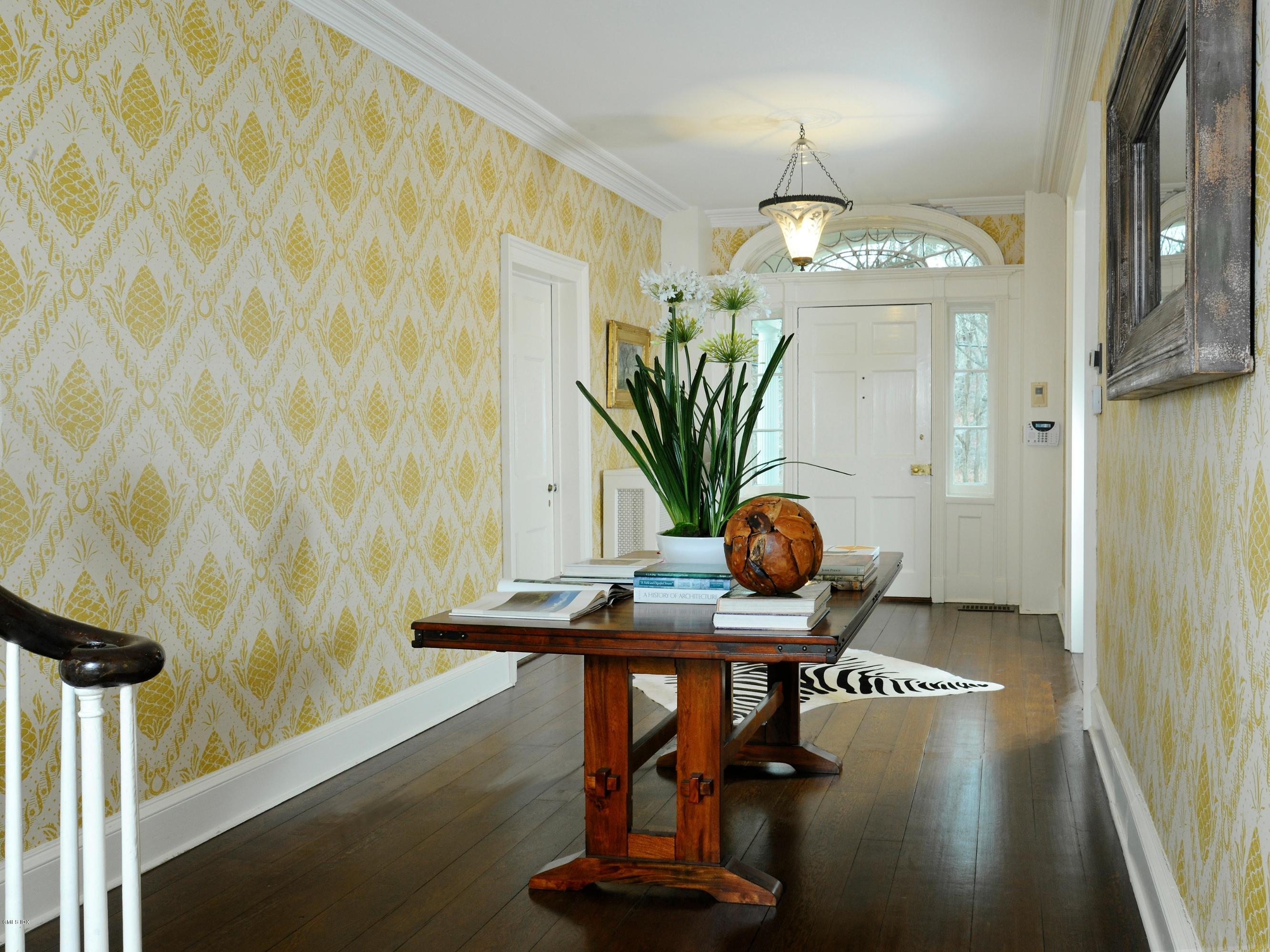 141 Taconic Road Greenwich, CT 06831 - Photo 21 of 30 a view of a dining room with furniture and chandelier