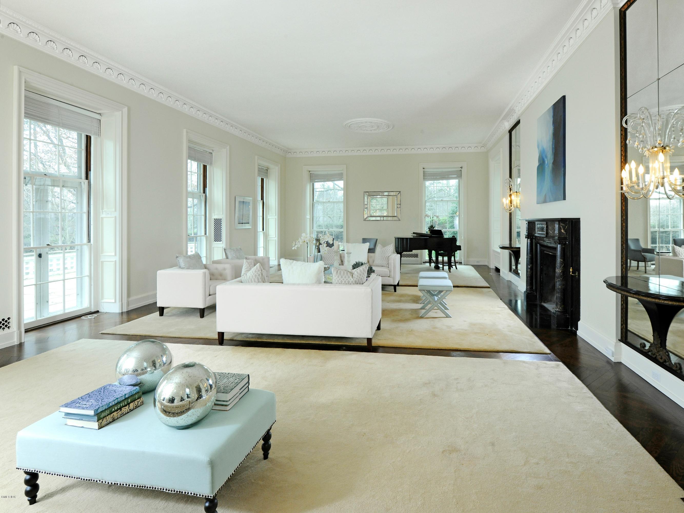 141 Taconic Road Greenwich, CT 06831 - Photo 4 of 30 a living room with furniture and a table