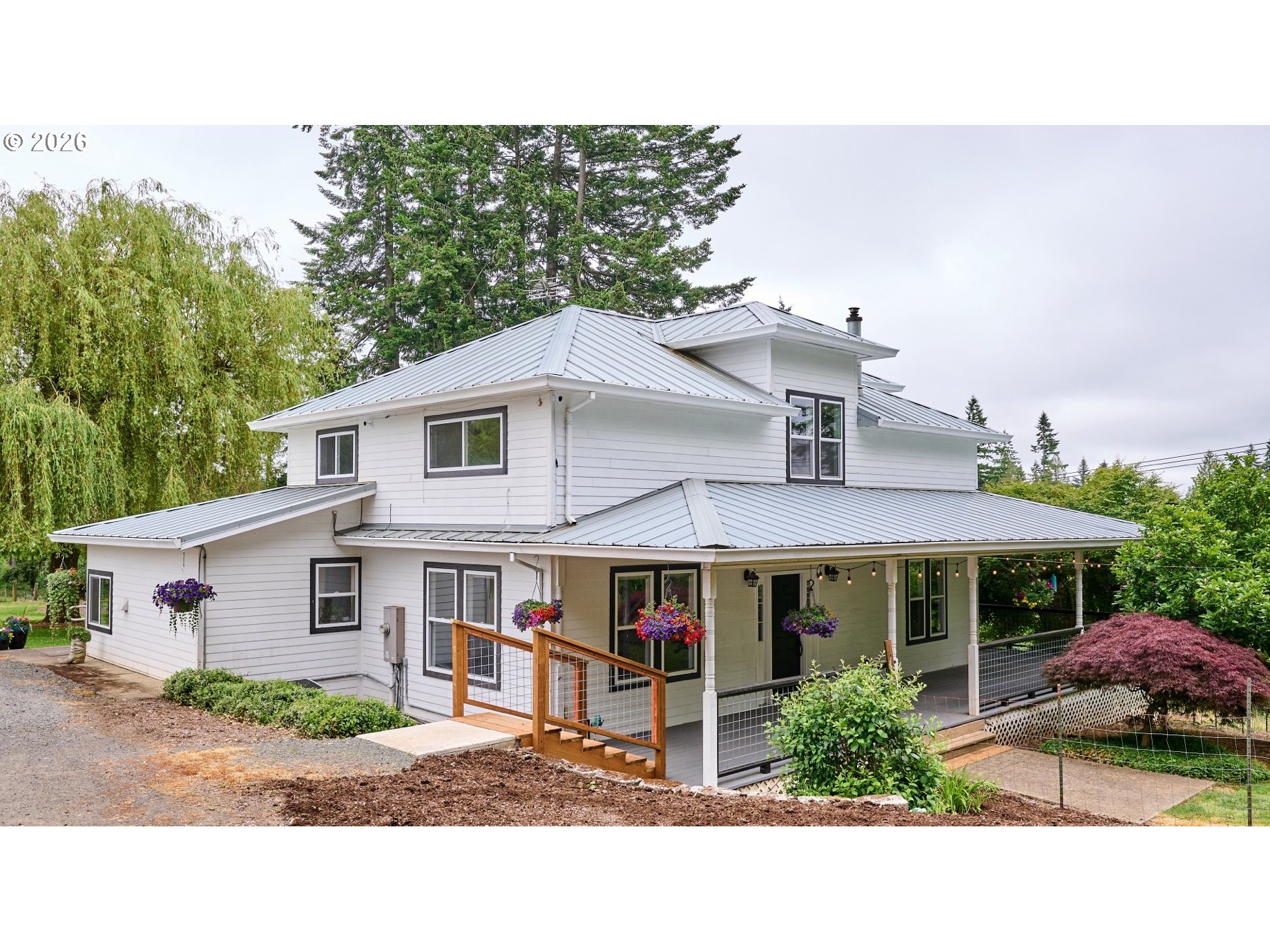 a front view of a house with garden