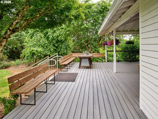 a view of a balcony with wooden floor