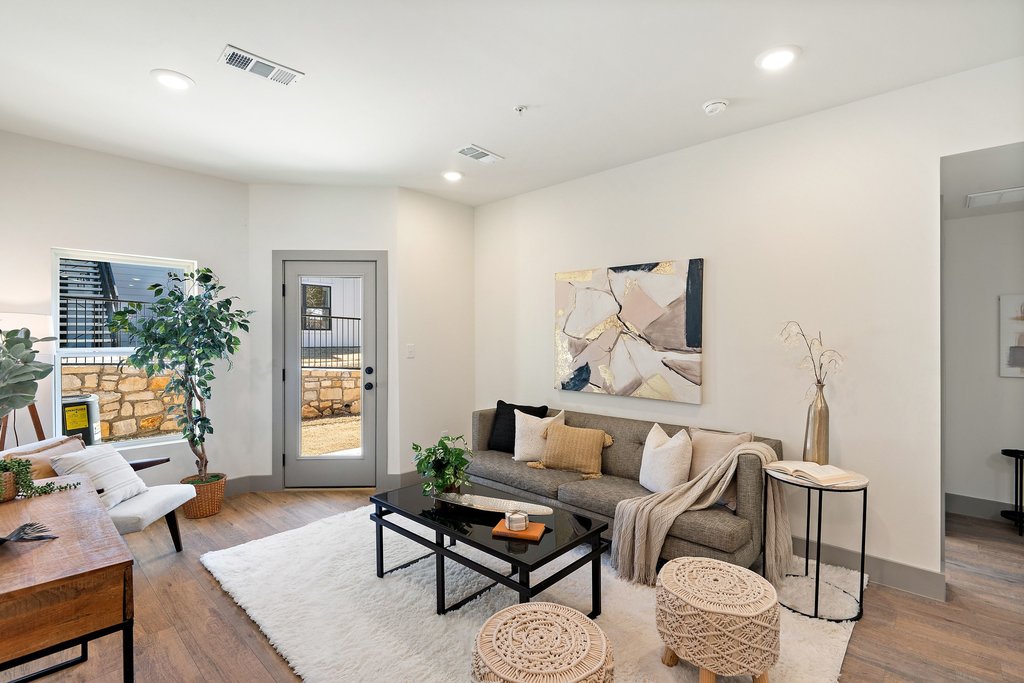 2450 Wickersham Lane, Unit 1916 Austin, TX 78741 - Photo 5 of 37 a living room with furniture and wooden floor