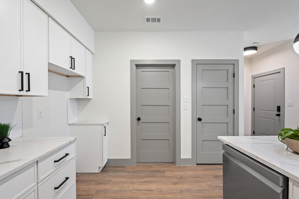 2450 Wickersham Lane, Unit 1916 Austin, TX 78741 - Photo 10 of 37 a room with cabinets and wooden floor