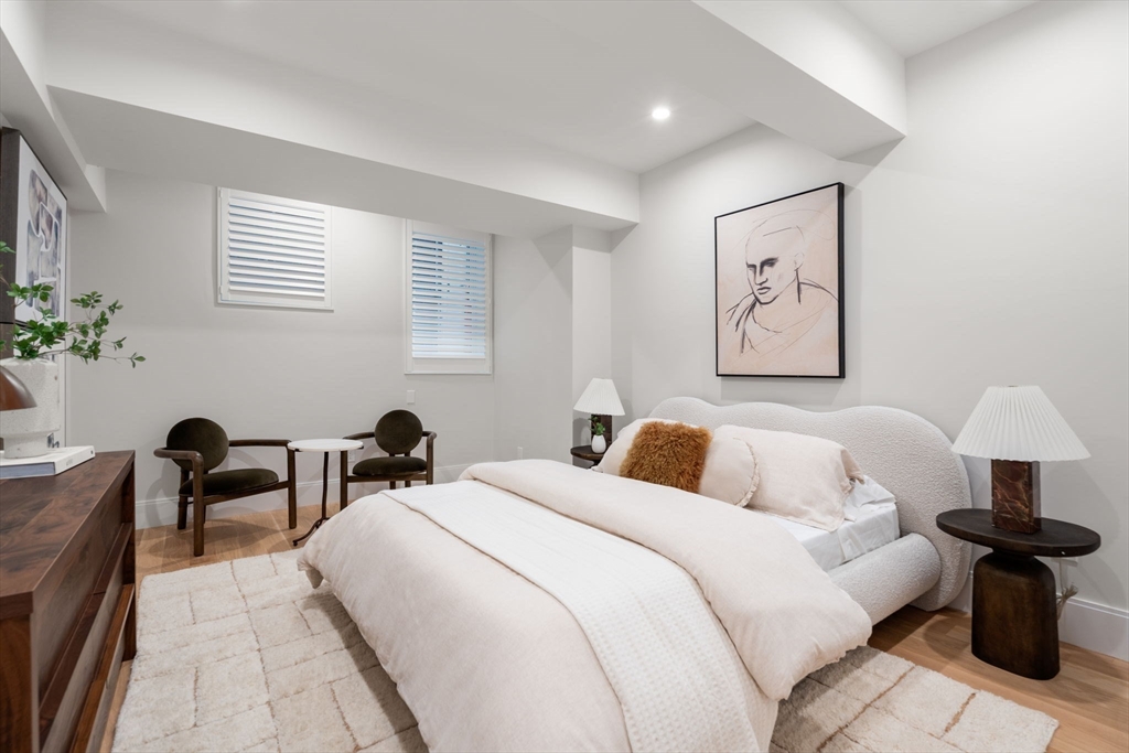 67 Church Street, Unit 1 Boston, MA 02116 - Photo 12 of 15 a bedroom with furniture and a lamp