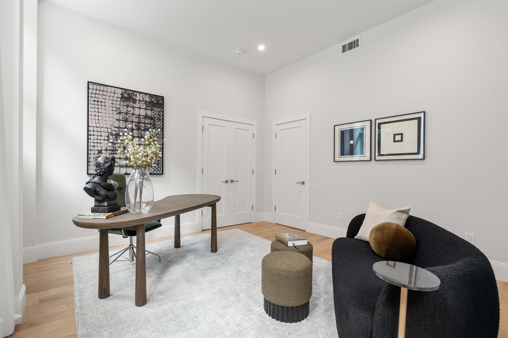 67 Church Street, Unit 1 Boston, MA 02116 - Photo 6 of 15 a room with furniture and a window