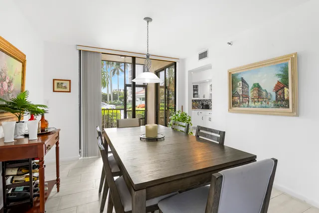 a kitchen with white cabinets and appliances