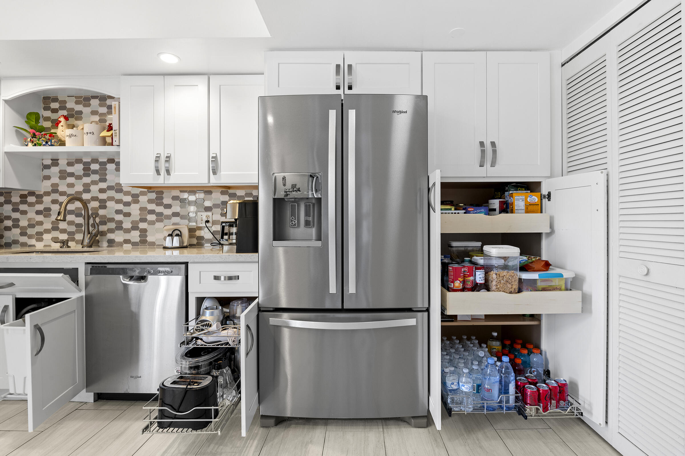 6845 Willow Wood Drive, Unit 3012 Boca Raton, FL 33434 - Photo 17 of 28 a kitchen with stainless steel appliances a refrigerator and a sink