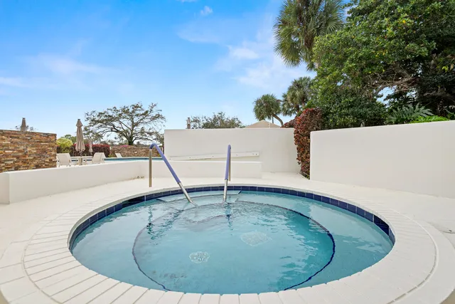 a view of swimming pool with outdoor seating