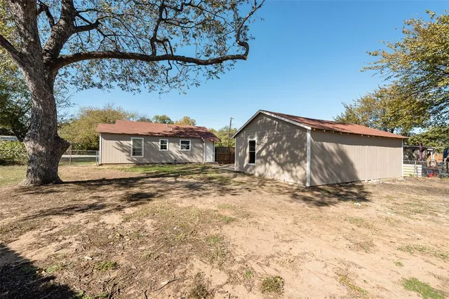 a view of a house with a snow in the yard