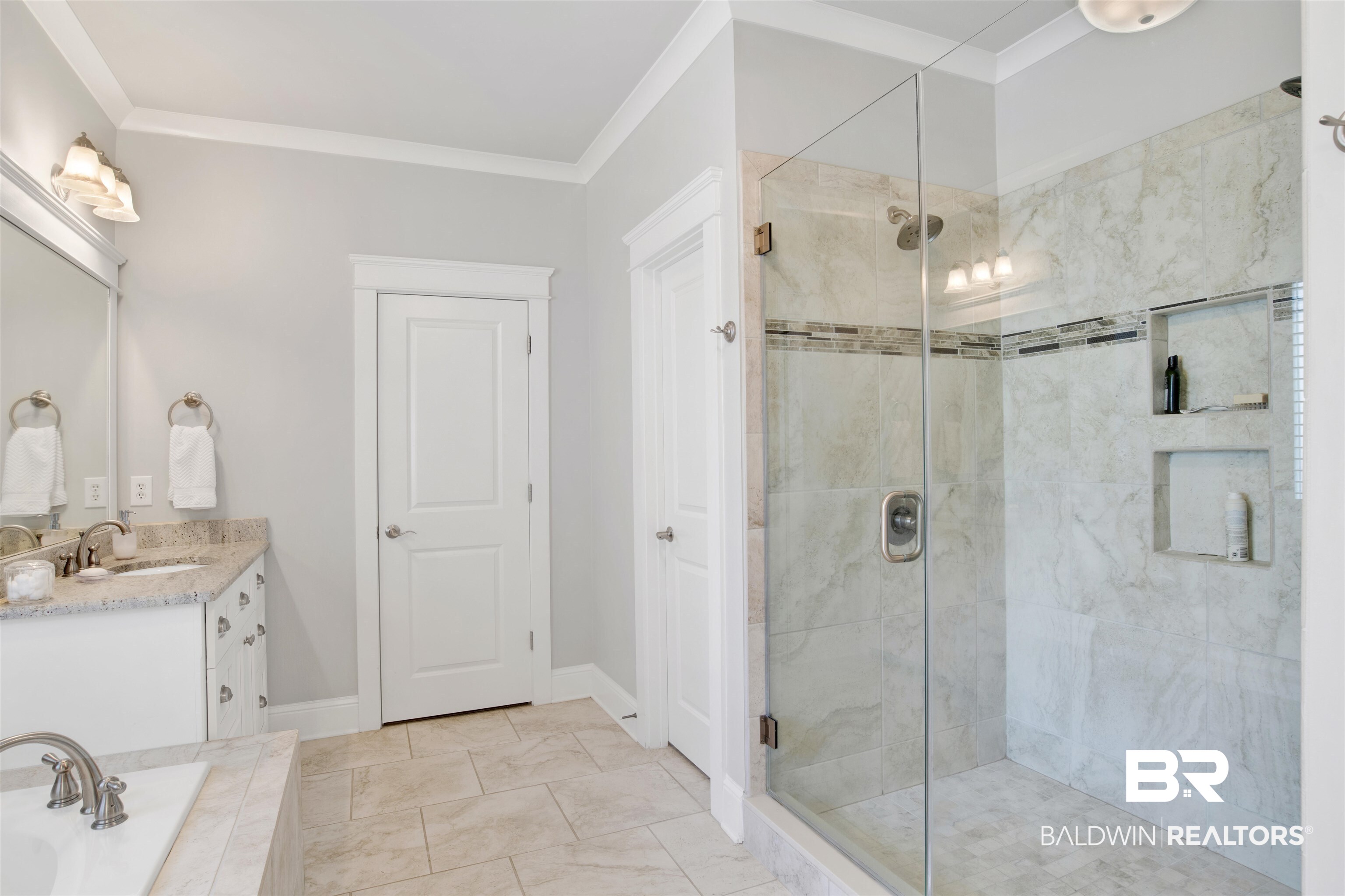 131 Sedgefield Avenue Fairhope, AL 36532 - Photo 25 of 50 Bathroom with walk in shower, vanity, crown molding, and tile patterned flooring