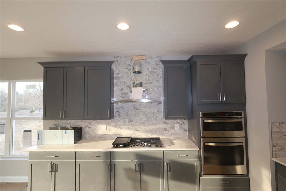 230 Tilly Court, Unit 4 Springboro, OH 45066 - Photo 9 of 20 This kitchen features sleek cabinetry and modern appliances, perfect for culinary enthusiasts.