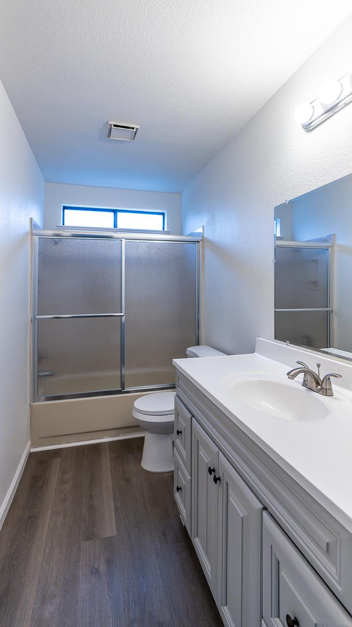 12501 Riverside Road Waterford, CA 95386 - Photo 13 of 24 a bathroom with a sink a toilet and shower