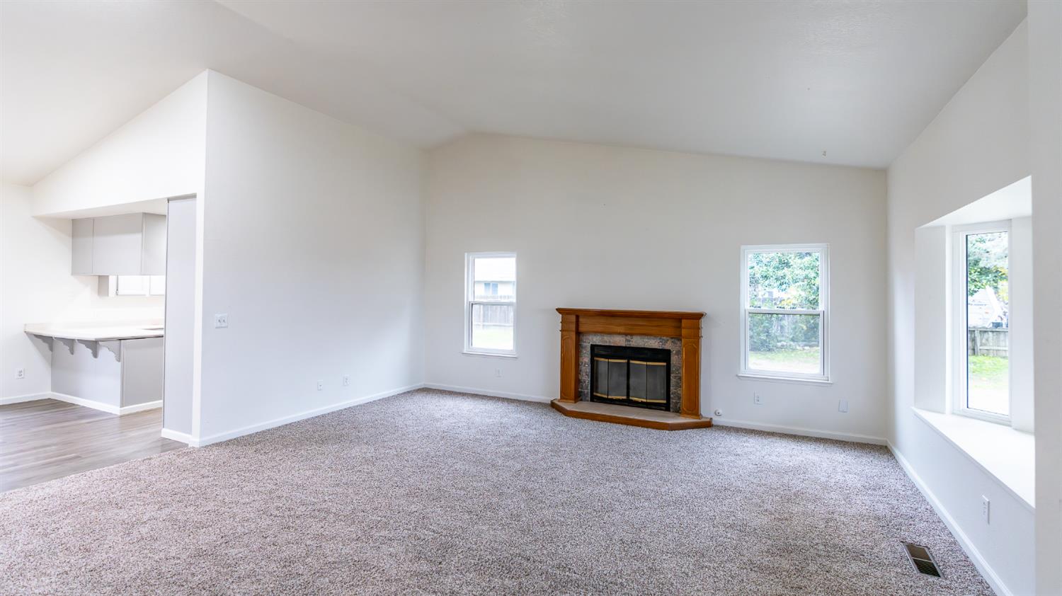 12501 Riverside Road Waterford, CA 95386 - Photo 5 of 24 a view of empty room with a fireplace