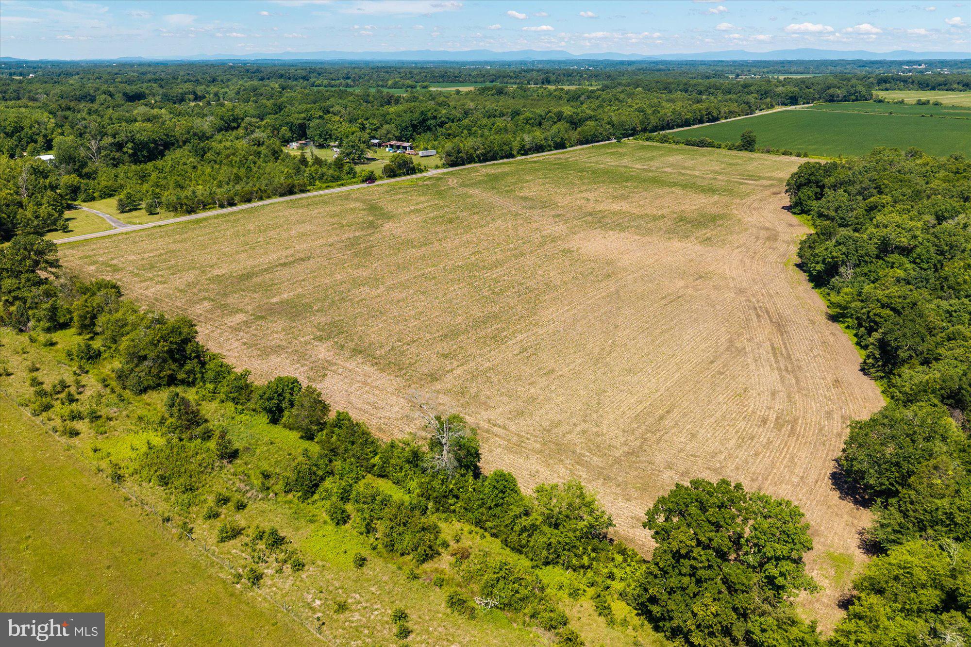 Expansive fields meet serene horizons.