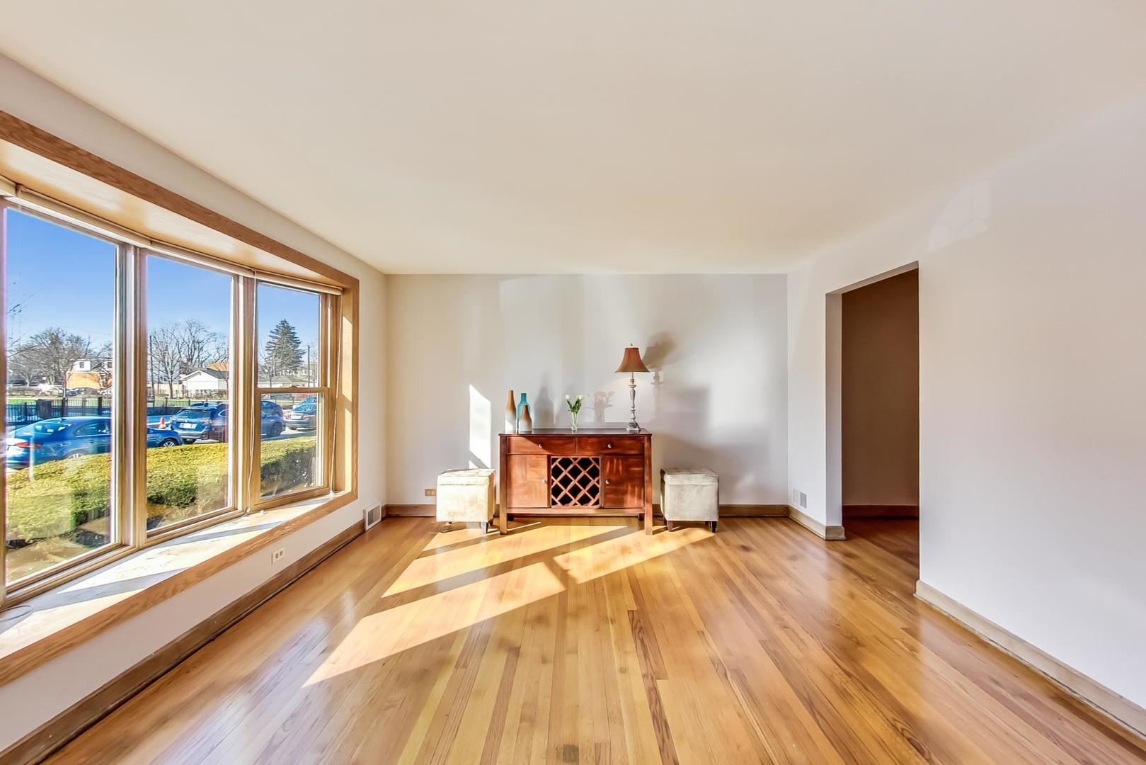 5231 North Rutherford Avenue Chicago, IL 60656 - Photo 4 of 43 a bedroom with a bed and a large window with outer view