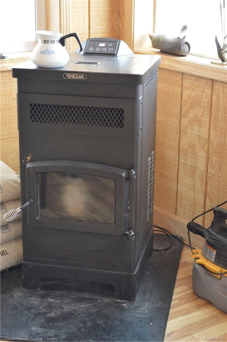 9797 Van Buren Road Fowlerville, MI 48836 - Photo 27 of 56 PELLET STOVE IN FLORIDA ROOM