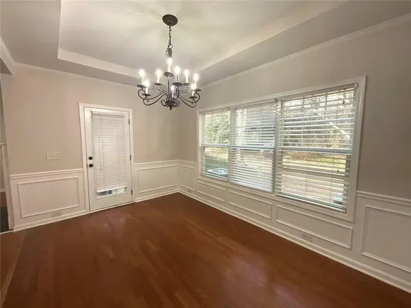 a white toilet sitting next to a bath tub
