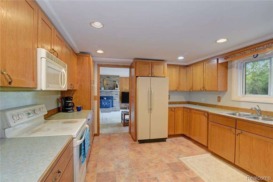 1362 Brogan Road Stockbridge, MI 49285 - Photo 18 of 36 Kitchen is off of the Living Room and Family Room