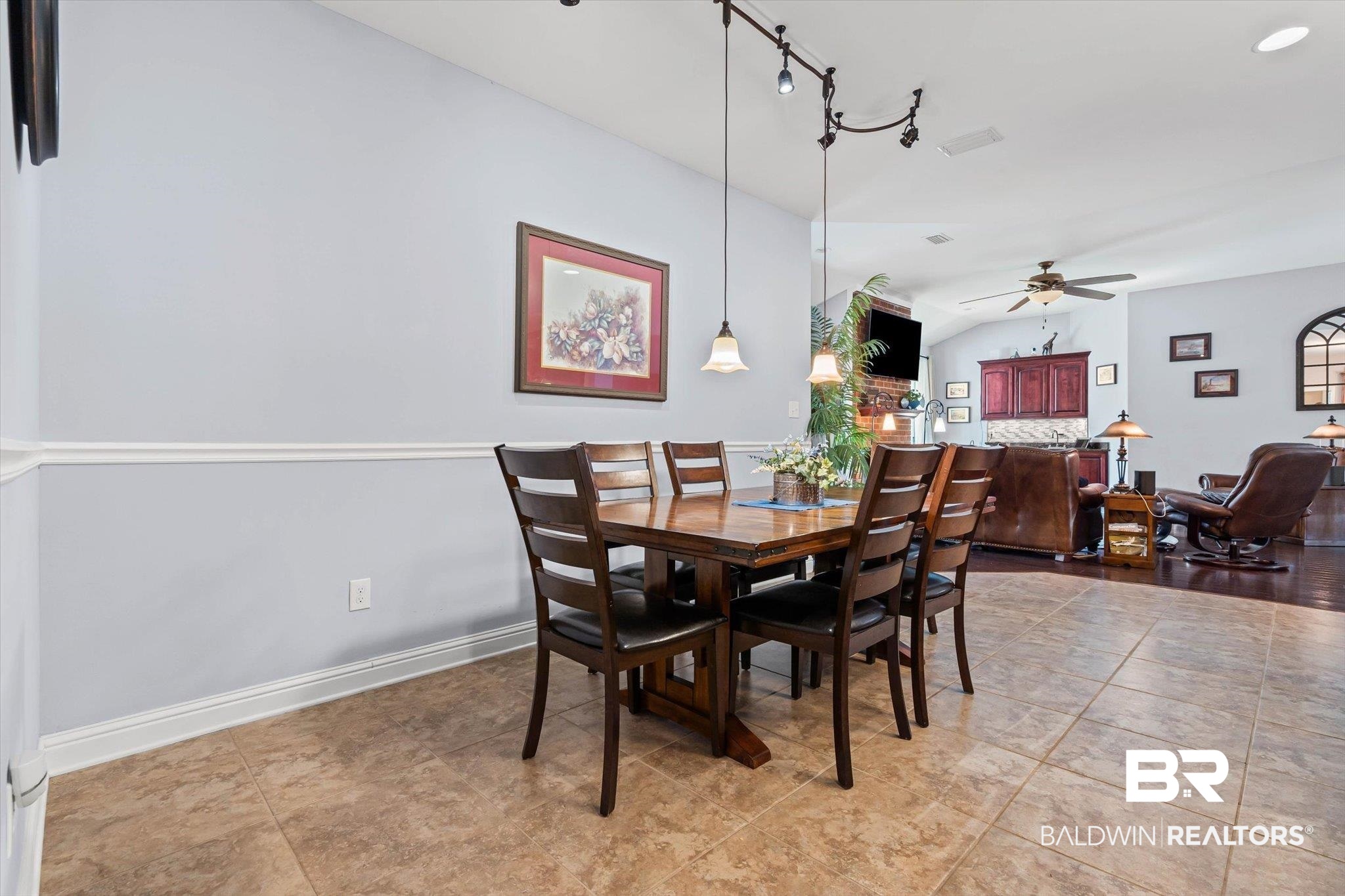 6175 South Grand Bay Wilmer Road Grand Bay, AL 36541 - Photo 9 of 42 Dining room featuring a ceiling fan, light tile patterned flooring, rail lighting, and lofted ceiling