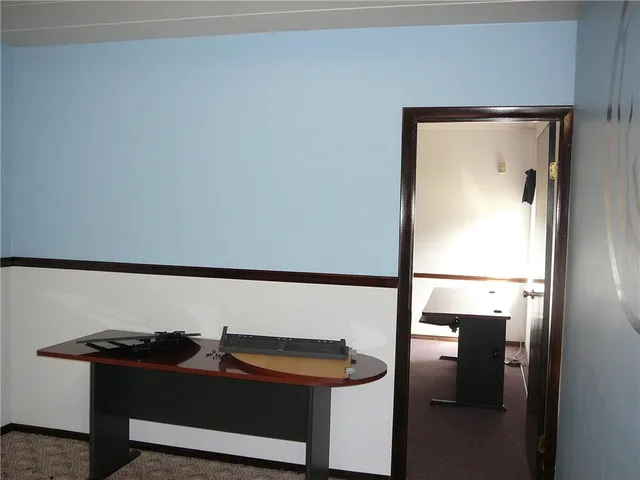 a room with a table and chairs