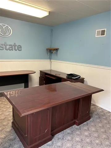 a kitchen with stainless steel appliances a sink dishwasher and white cabinets
