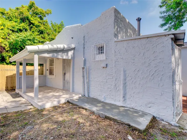 a view of backyard of a house