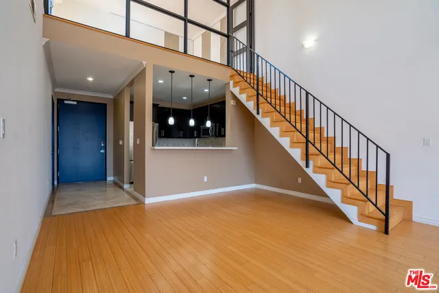 a view of an entryway with wooden floor