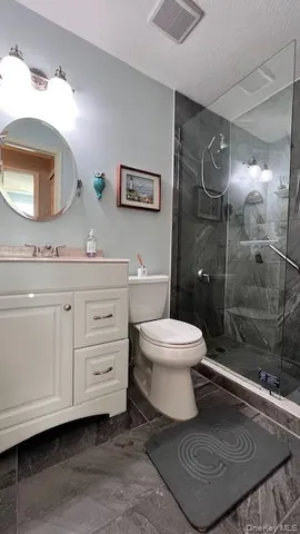 a bedroom with a large bed and a large window