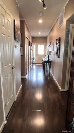 a bedroom with furniture and a flat screen tv