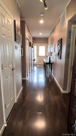 a bedroom with furniture and a flat screen tv