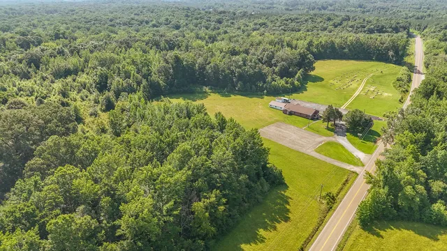 an aerial view of a house with a swimming pool