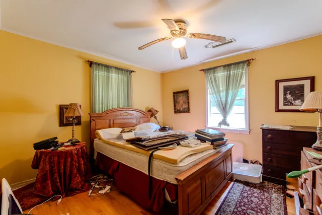 a bedroom with furniture and a window