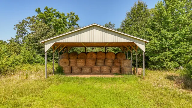 a house view with a sitting space and garden