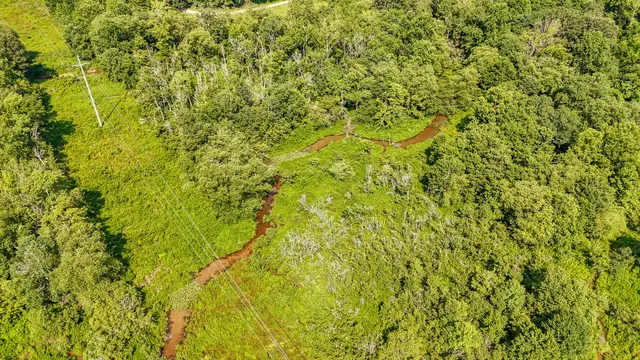a view of a lake with a yard