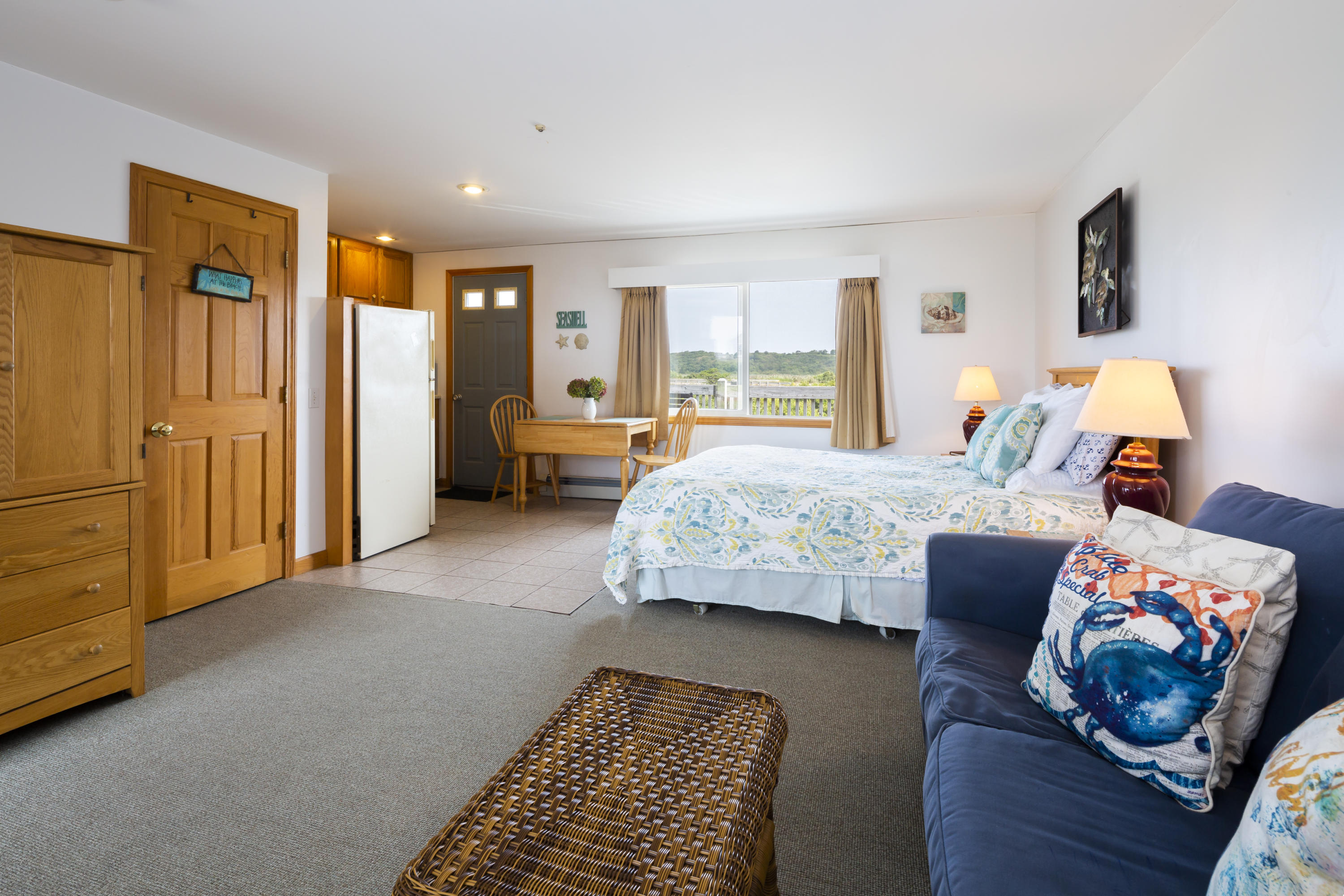 307 Shore Road, Unit 9 & SB2 Truro, MA 02666 - Photo 2 of 13 a bedroom with furniture and a couch