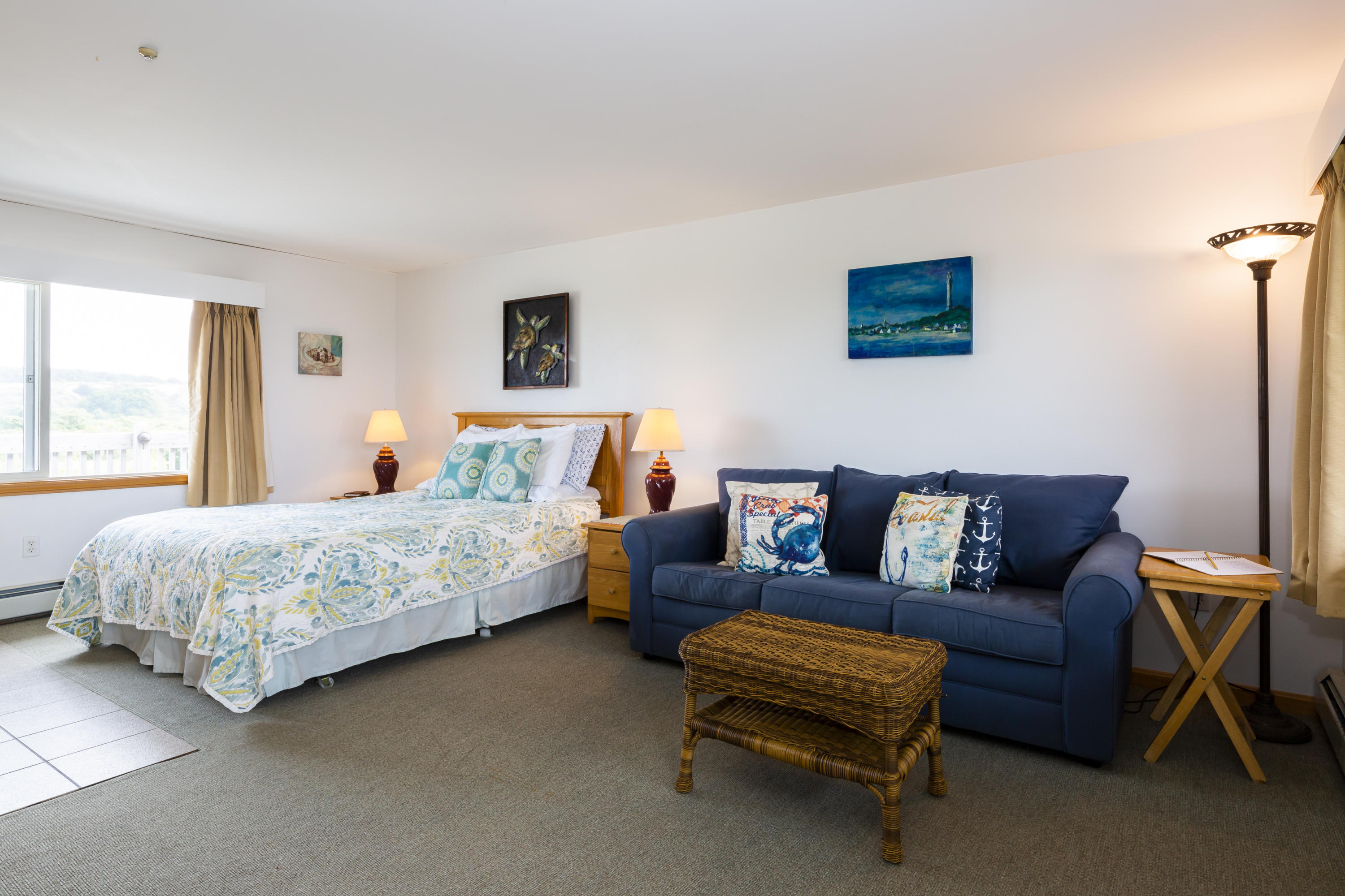 307 Shore Road, Unit 9 & SB2 Truro, MA 02666 - Photo 3 of 13 a bedroom with a bed and a couch